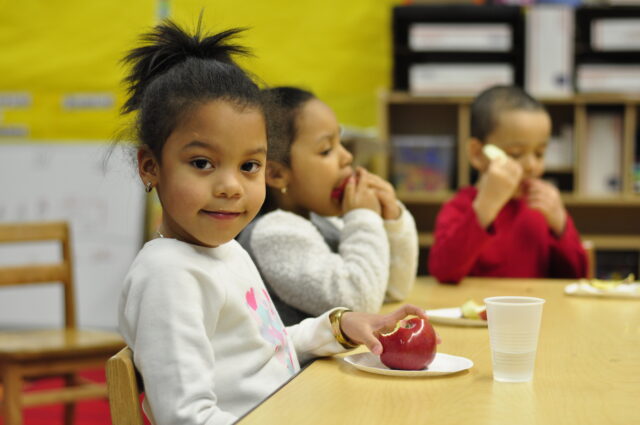 Child Eating an Apple