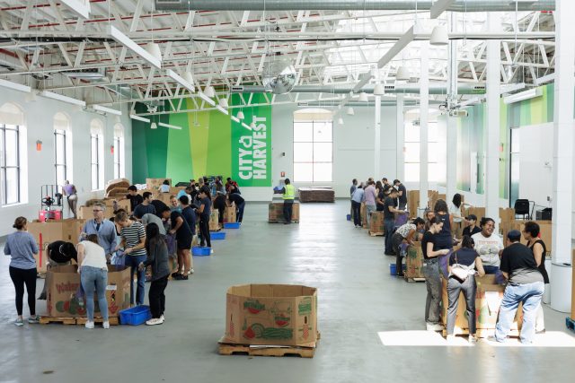 Volunteers repacking in the finished Repack Room. 